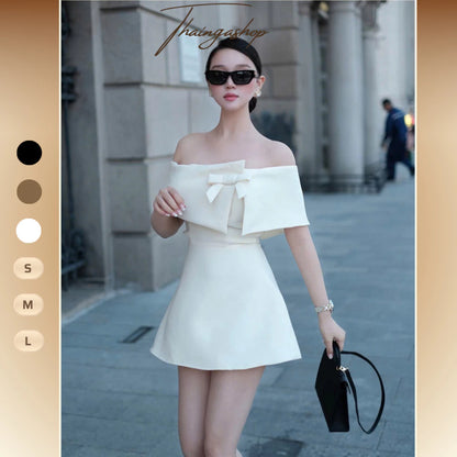 Đầm Dự Tiệc Trễ Vai Siết Eo Đính Nơ Dáng Ngắn Sang Trọng – Màu Sắc Khỏa Thân, Trắng, Đen – Size SML – Mã D1438